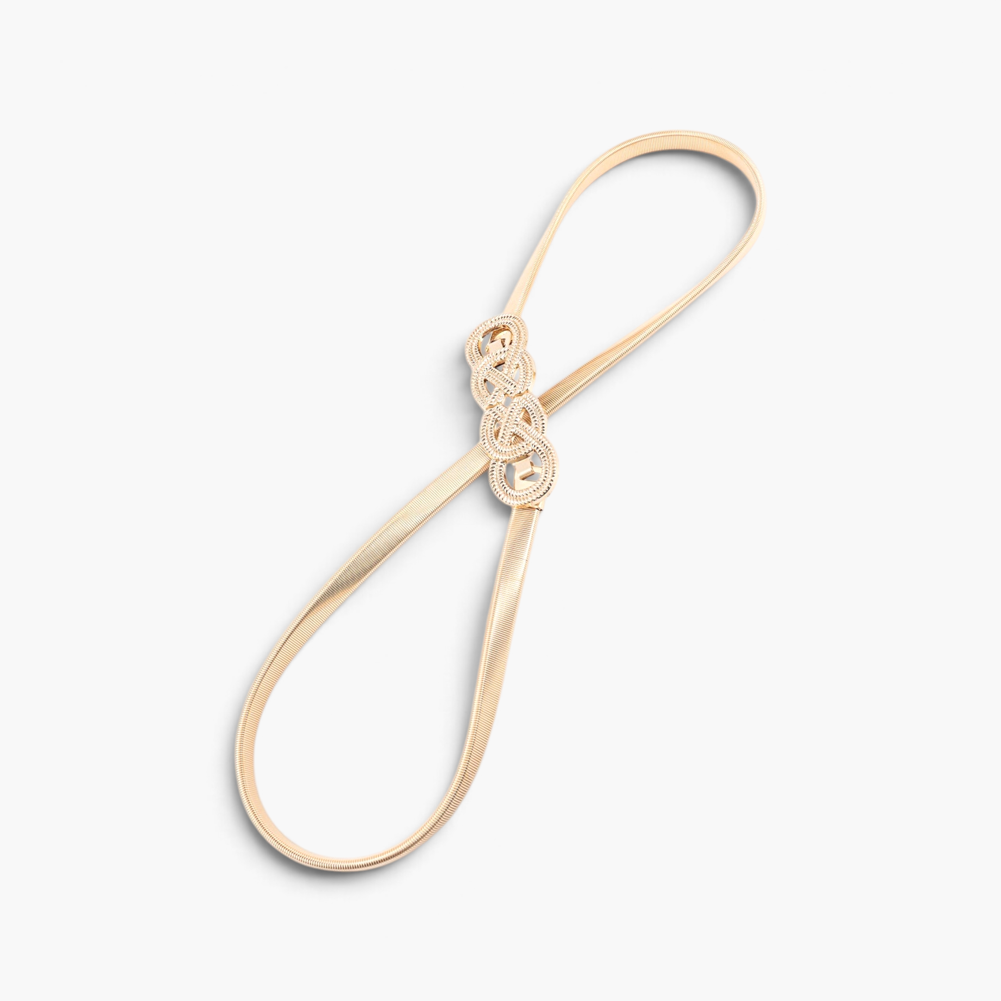 Beach Rose Co. gold metal waist belt featuring a slim ridged band and an intricate interwoven knot buckle design.