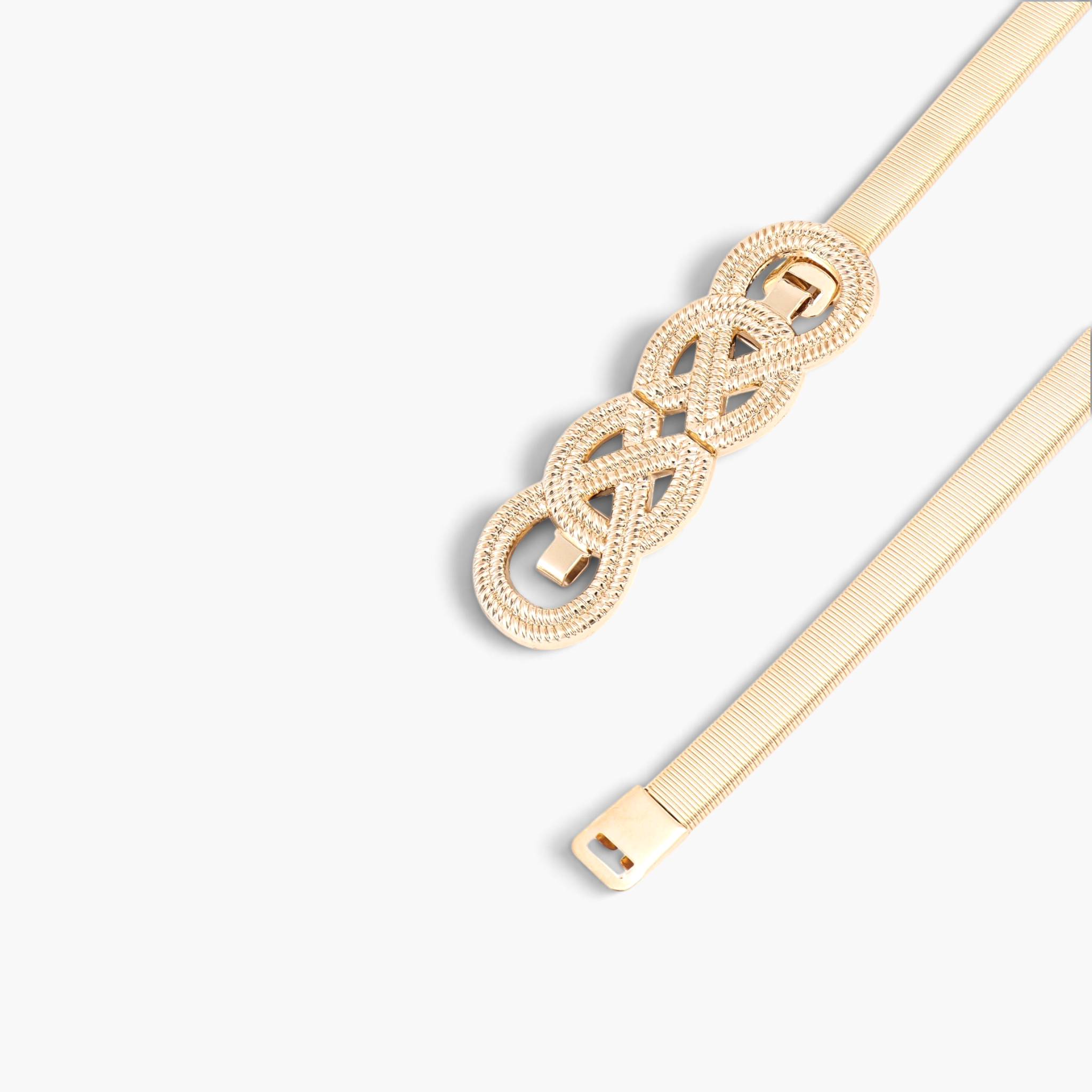 Beach Rose Co. gold metal waist belt featuring a slim ridged band and an intricate interwoven knot buckle design.