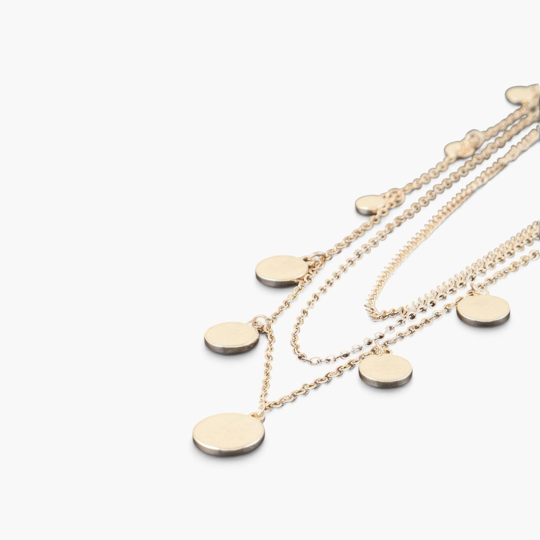 Beach Rose Co. gold layered chain necklace featuring delicate round charms for a minimalist and elegant look.