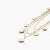 Beach Rose Co. gold layered chain necklace featuring delicate round charms for a minimalist and elegant look.