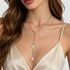 Beach Rose Co. 18K gold-plated layered Y-necklace featuring petite white faux pearls and two irregular pearl drops.