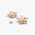 Beach Rose Co. gold maple leaf earrings with intricate textured metal details, shown next to a coin for scale.
