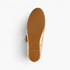 Beach Rose Co. gold Mary Jane flats showing the textured brown rubber sole and flat heel design