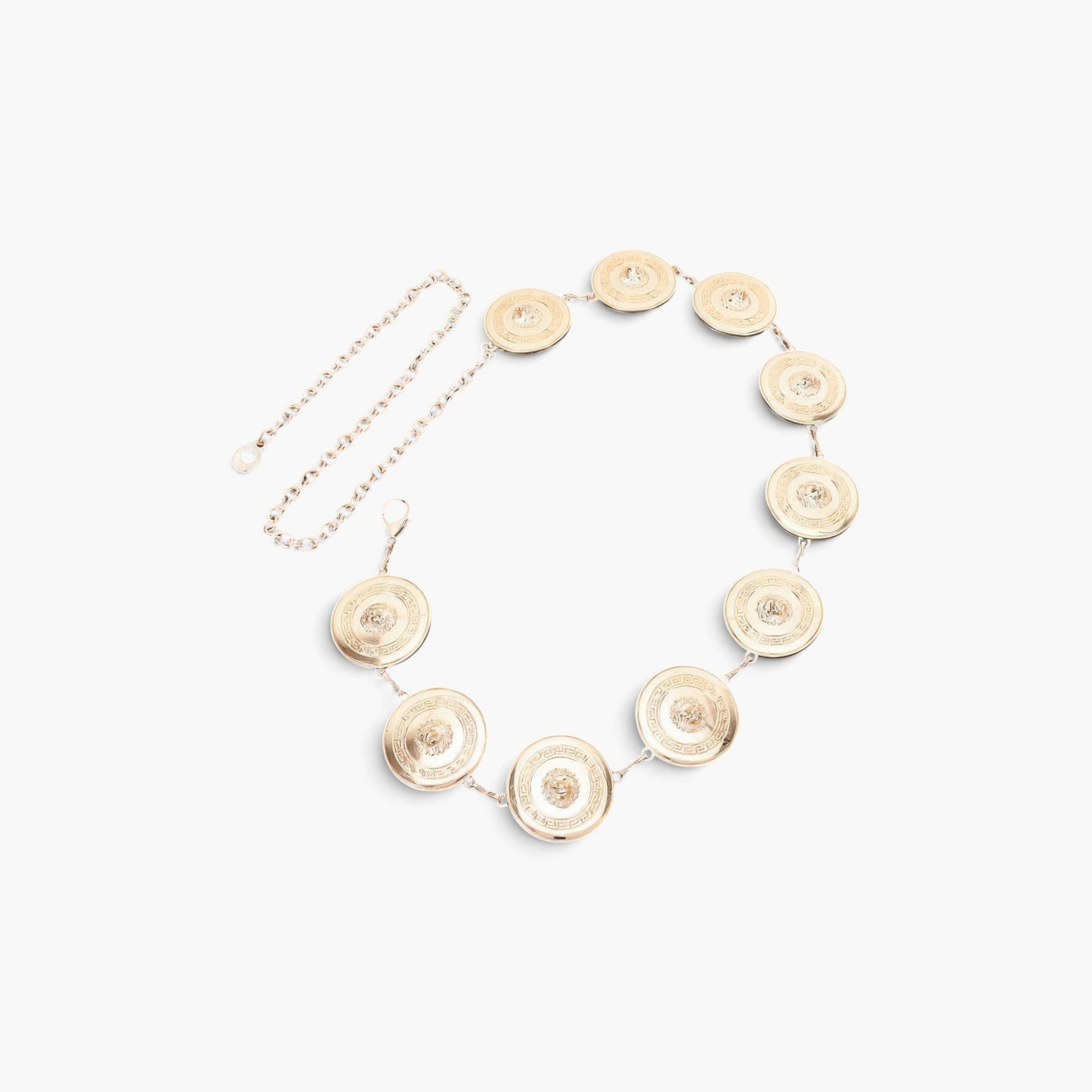 Beach Rose Co. gold metal chain belt featuring circular medallions with intricate embossed designs.