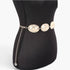 Beach Rose Co. gold metal chain belt featuring shimmering textured discs on a black mannequin torso