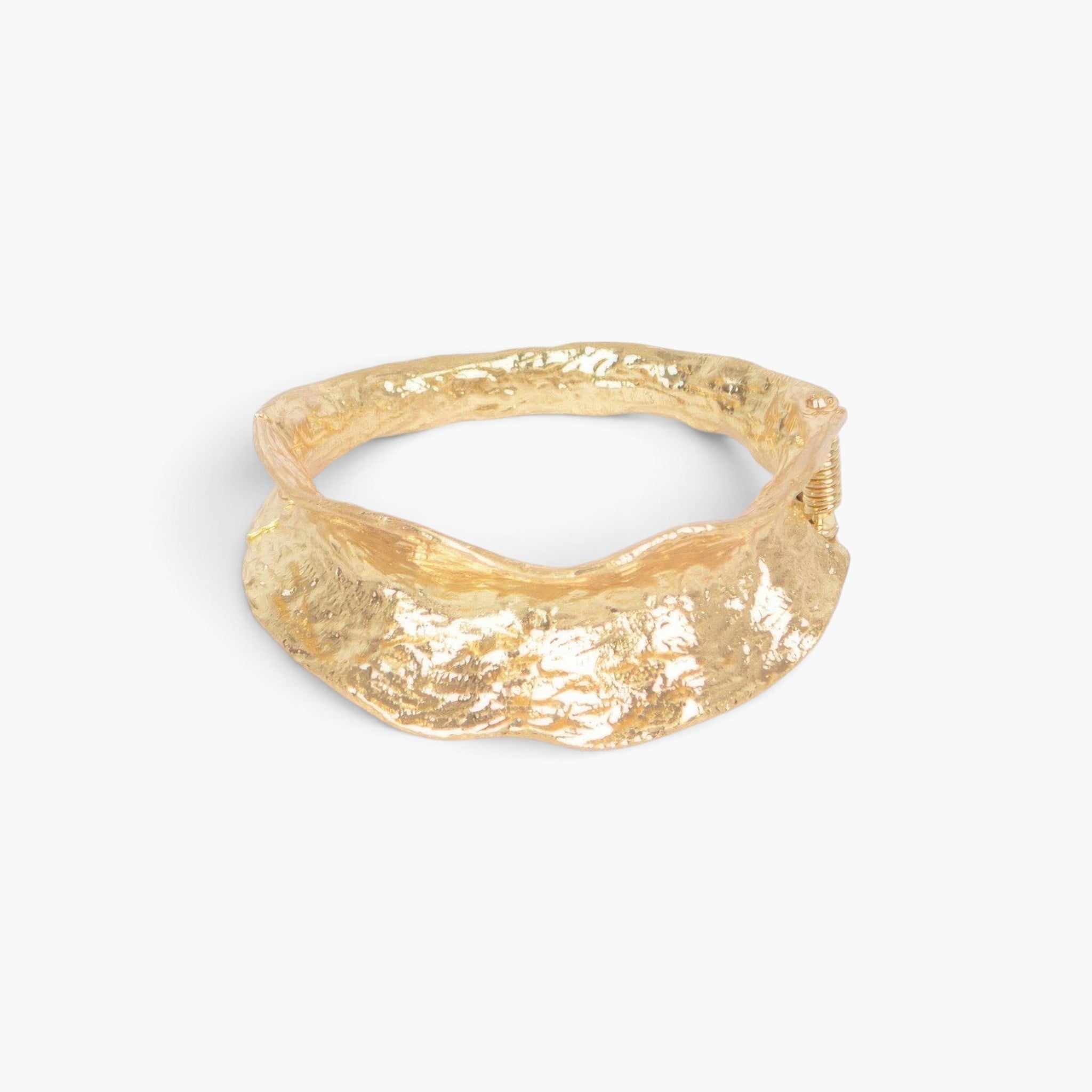 Beach Rose Co. gold metal cuff bracelet with a textured vintage-inspired design and adjustable hinge closure.