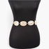 Beach Rose Co. gold metal chain belt featuring shimmering hammered discs on a black mannequin torso
