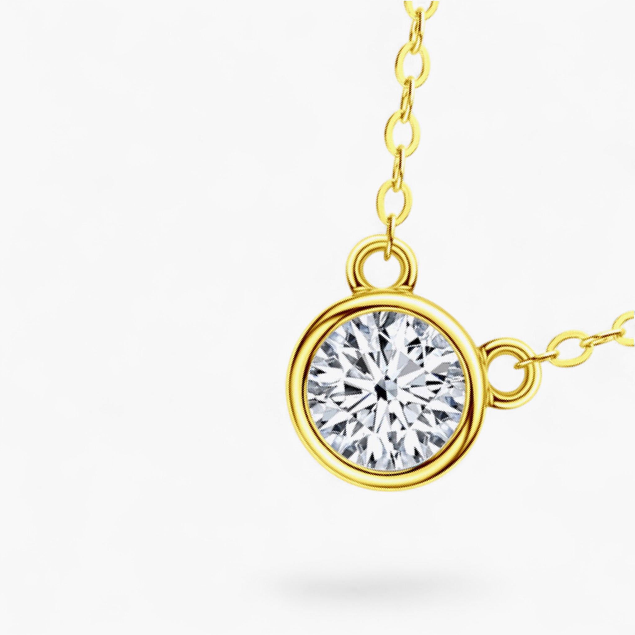 Beach Rose Co. 1 carat round moissanite solitaire necklace in a gold bezel setting on a delicate link chain