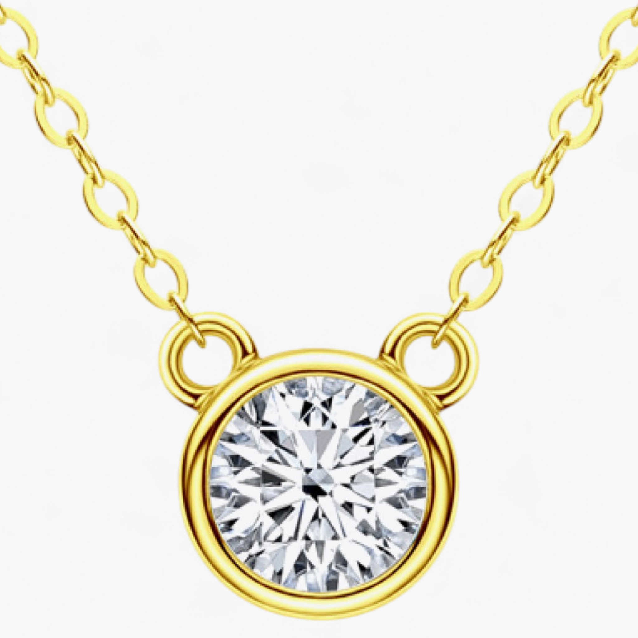 Beach Rose Co. 1 carat round moissanite solitaire necklace in a gold bezel setting on a delicate link chain.