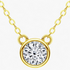 Beach Rose Co. 1 carat round moissanite solitaire necklace in a gold bezel setting on a delicate link chain.