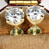 Beach Rose Co. 1 carat round moissanite stud earrings in gold-plated sterling silver with four-prong settings.