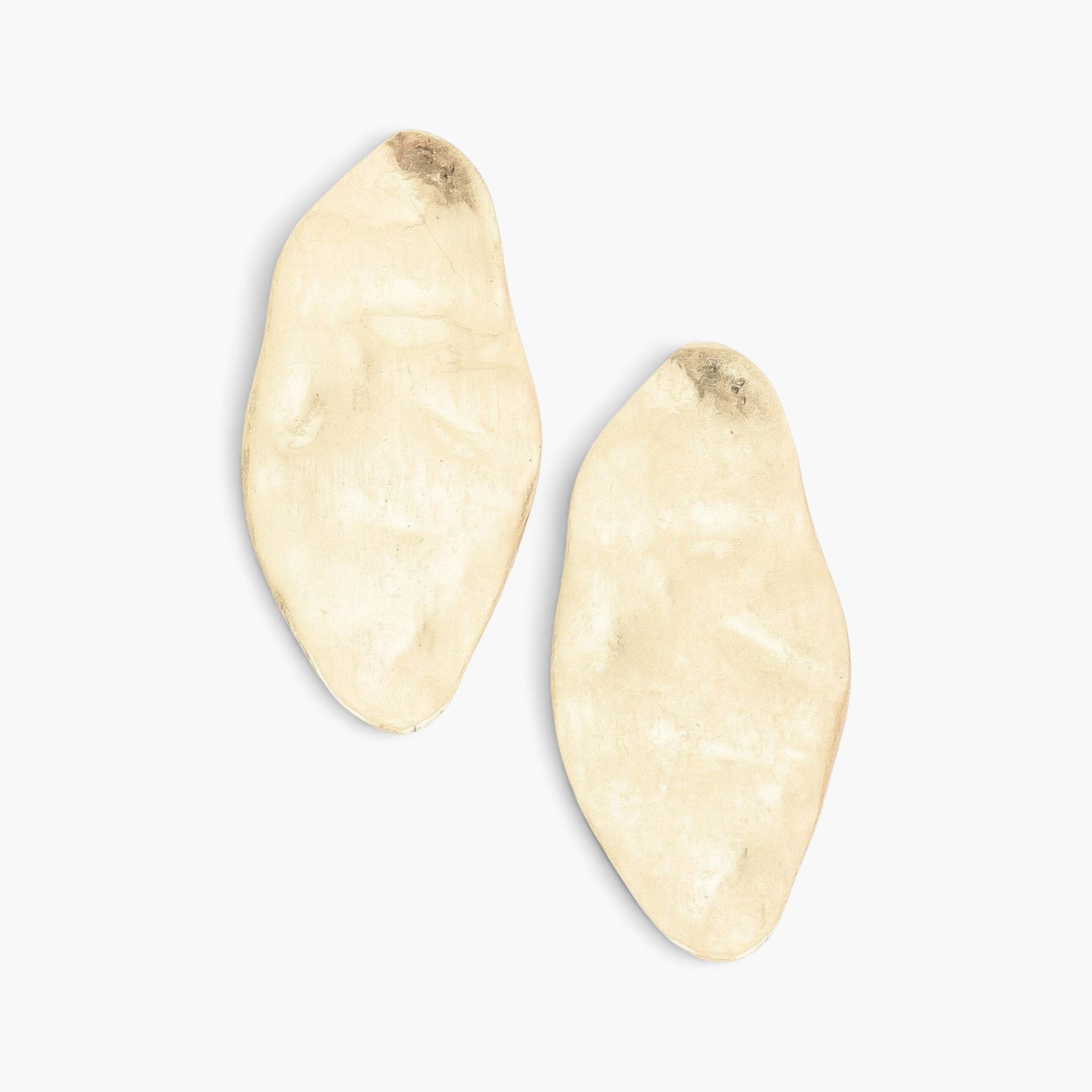 Beach Rose Co. gold-plated metal earrings with a large, organic oval shape and a smooth, polished finish.