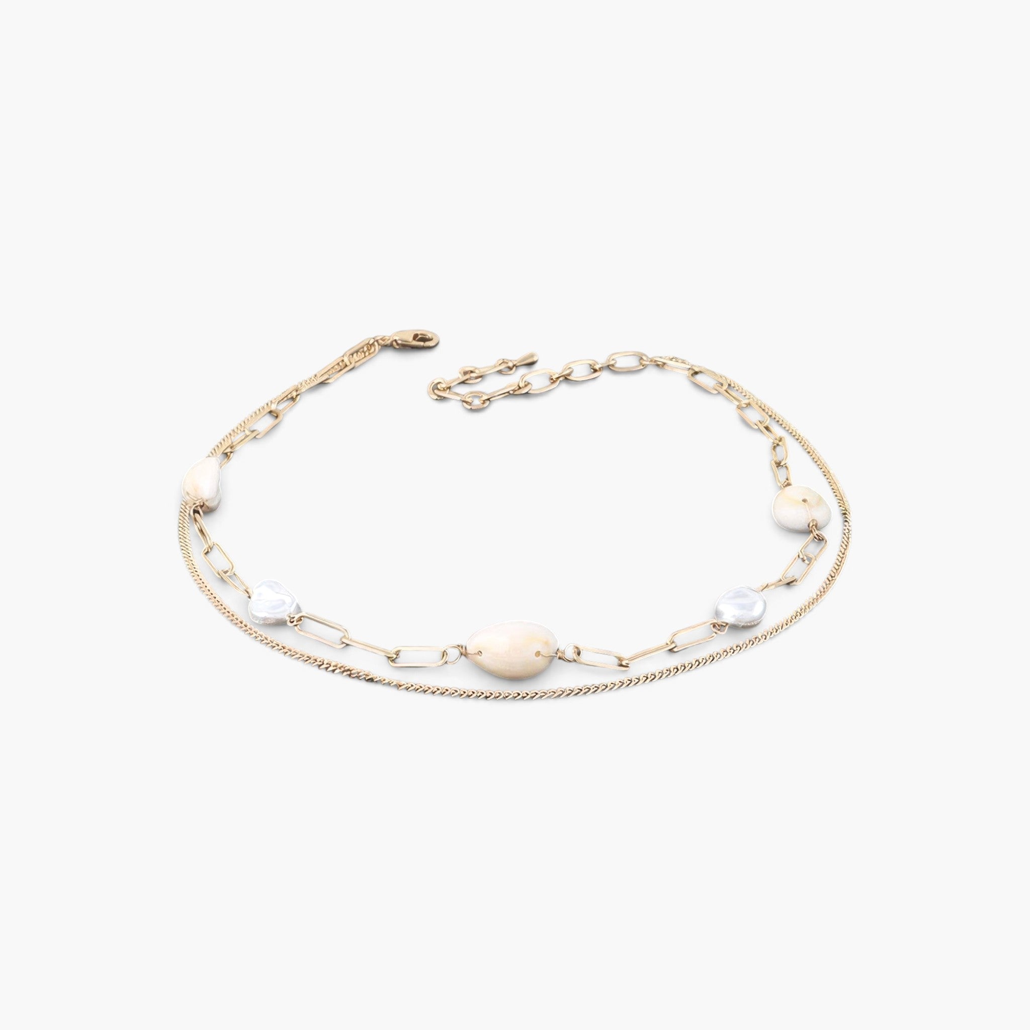 Beach Rose Co. gold chain necklace featuring two delicate pearls on a layered metal design against a white background.