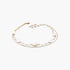 Beach Rose Co. gold chain necklace featuring two delicate pearls on a layered metal design against a white background.