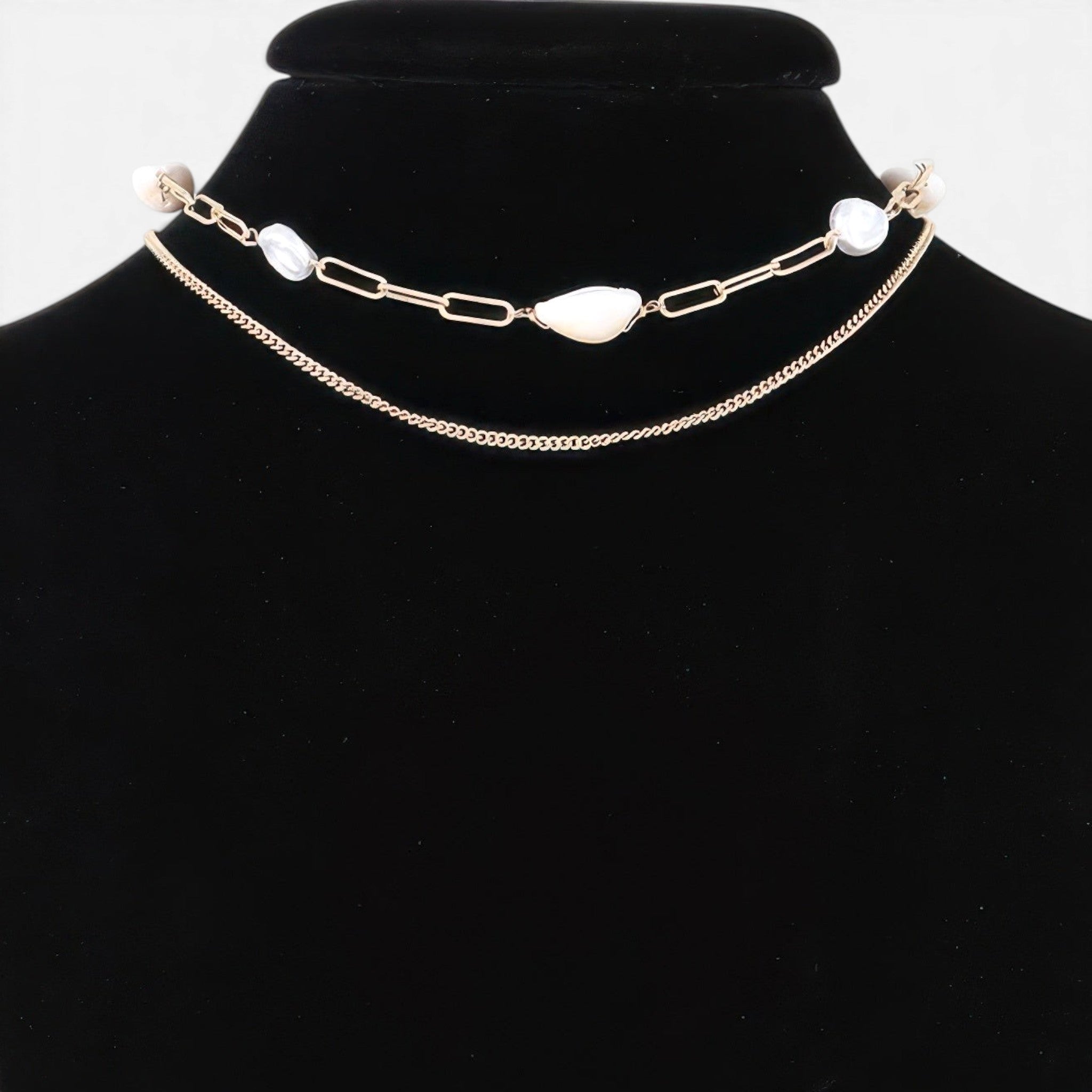 Beach Rose Co. gold double chain necklace featuring lustrous white pearls on a black velvet display bust