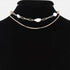 Beach Rose Co. gold double chain necklace featuring lustrous white pearls on a black velvet display bust
