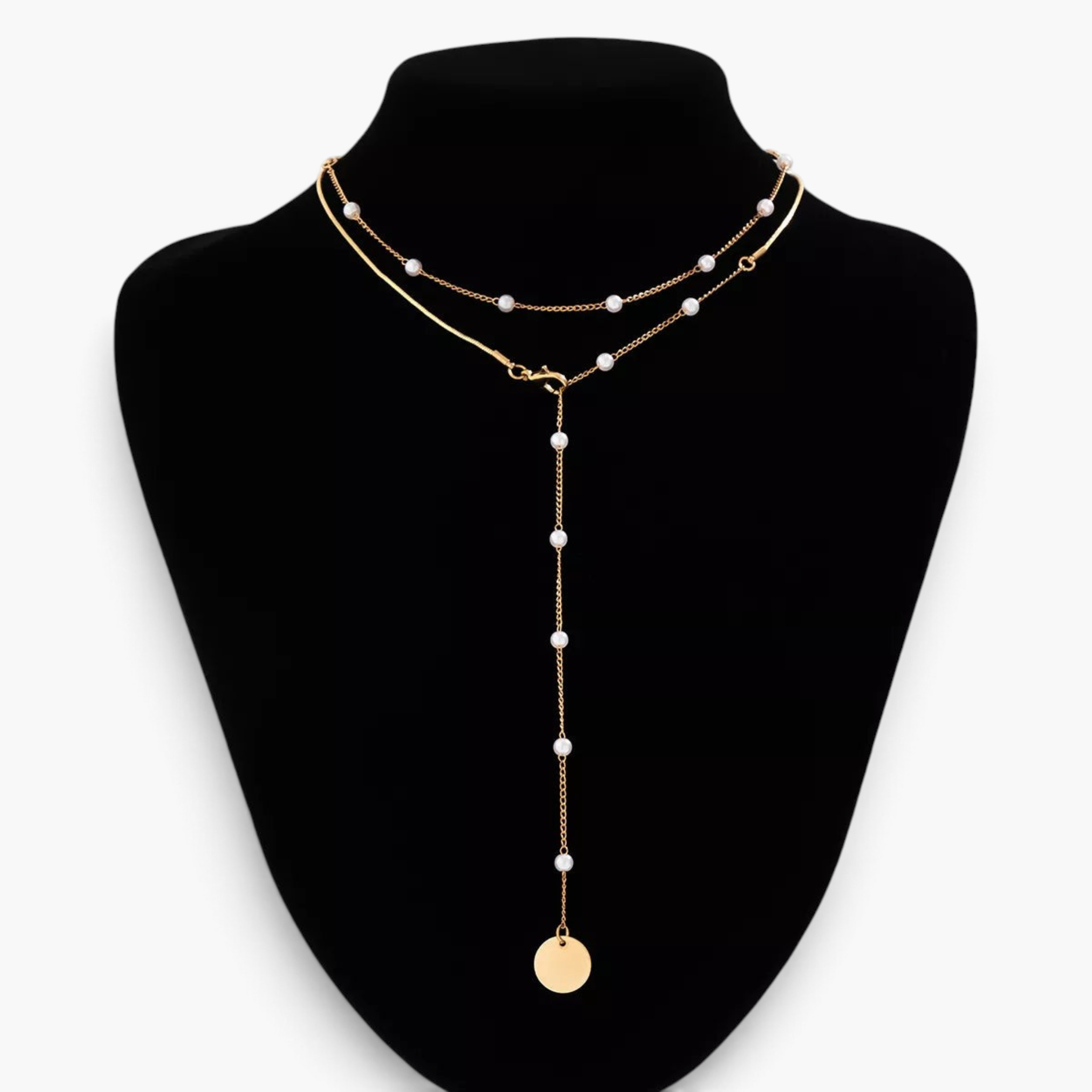 Beach Rose Co. 18K gold-plated lariat necklace featuring white synthetic pearls, mixed chains, and a round disc charm.