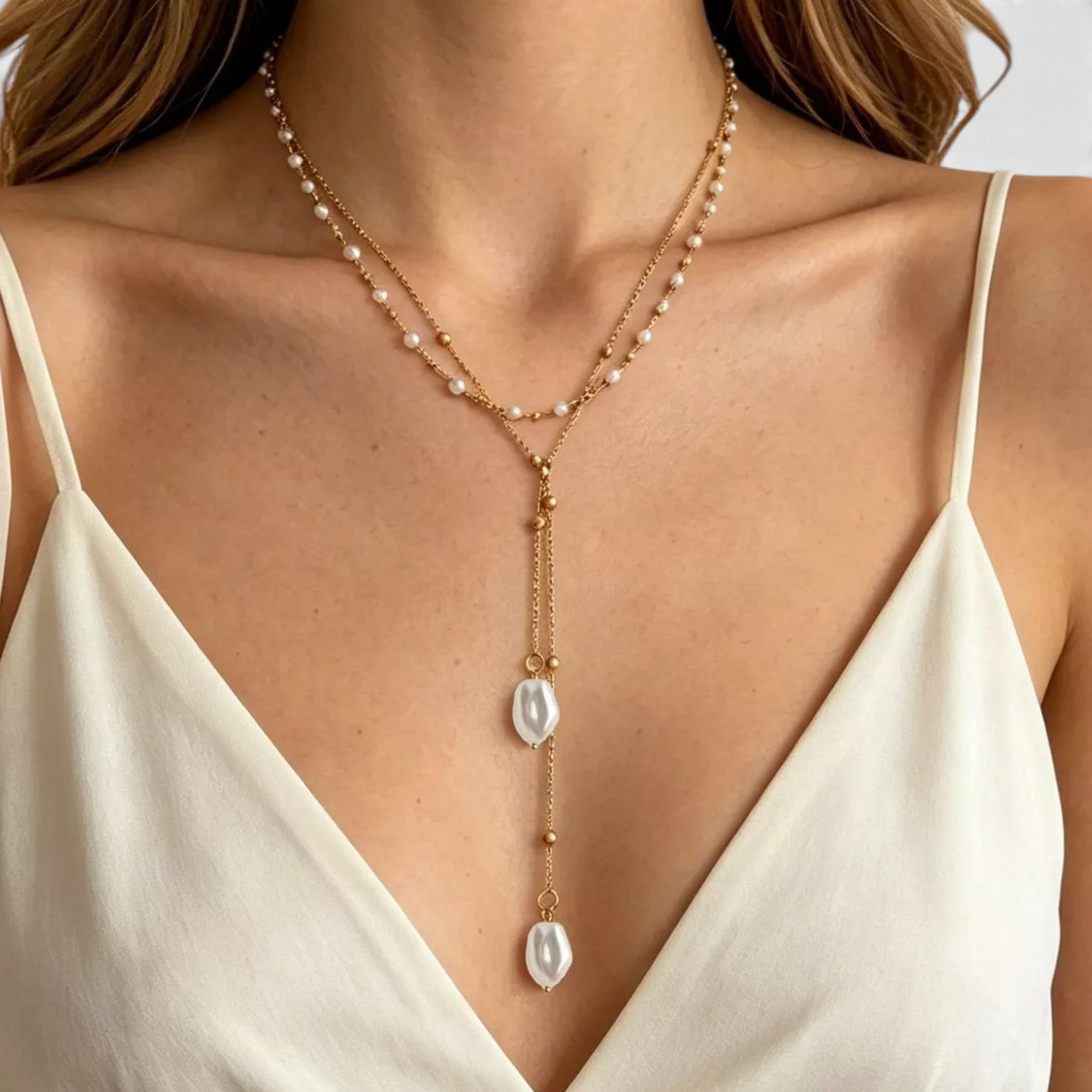 Beach Rose Co. 18K gold-plated layered Y-necklace featuring petite white faux pearls and irregular drop pendants.