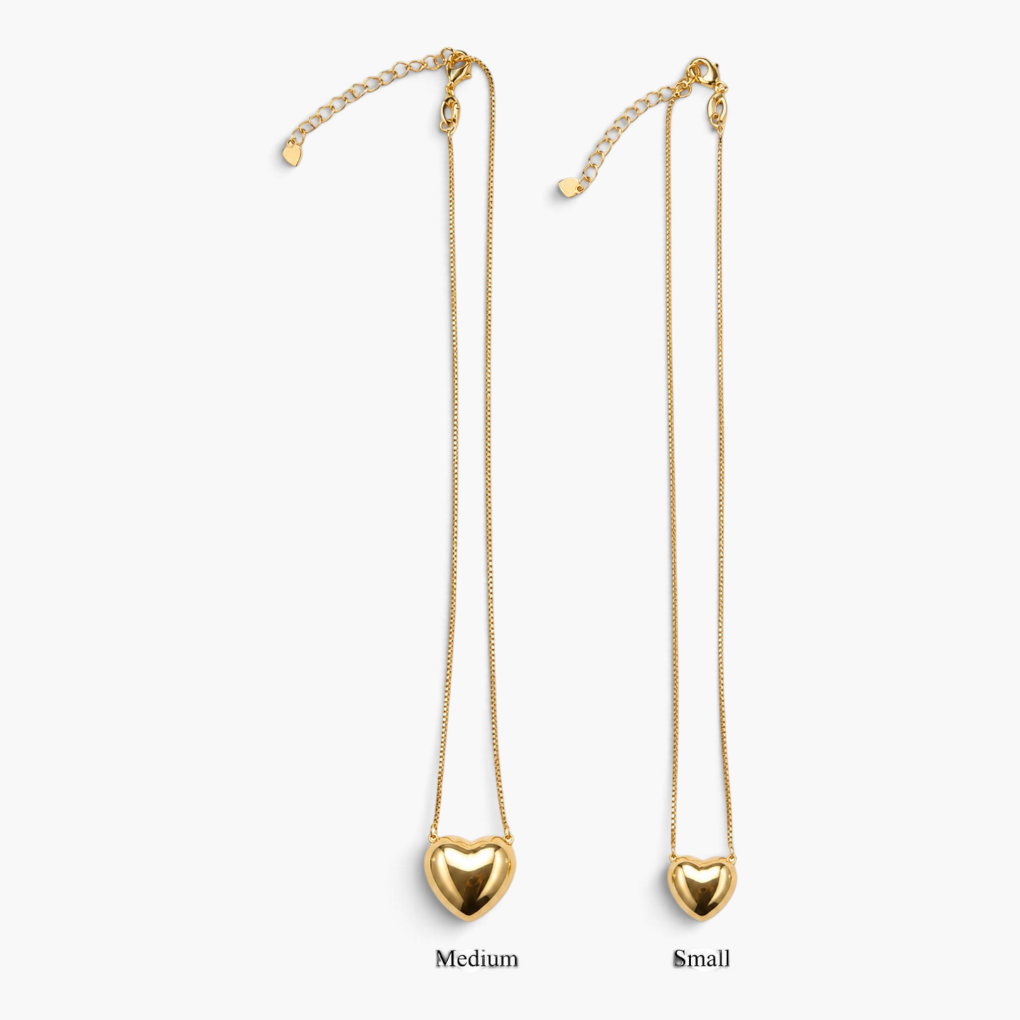 Beach Rose Co. gold puff heart pendant necklaces in small and medium sizes on delicate chains with lobster clasps.