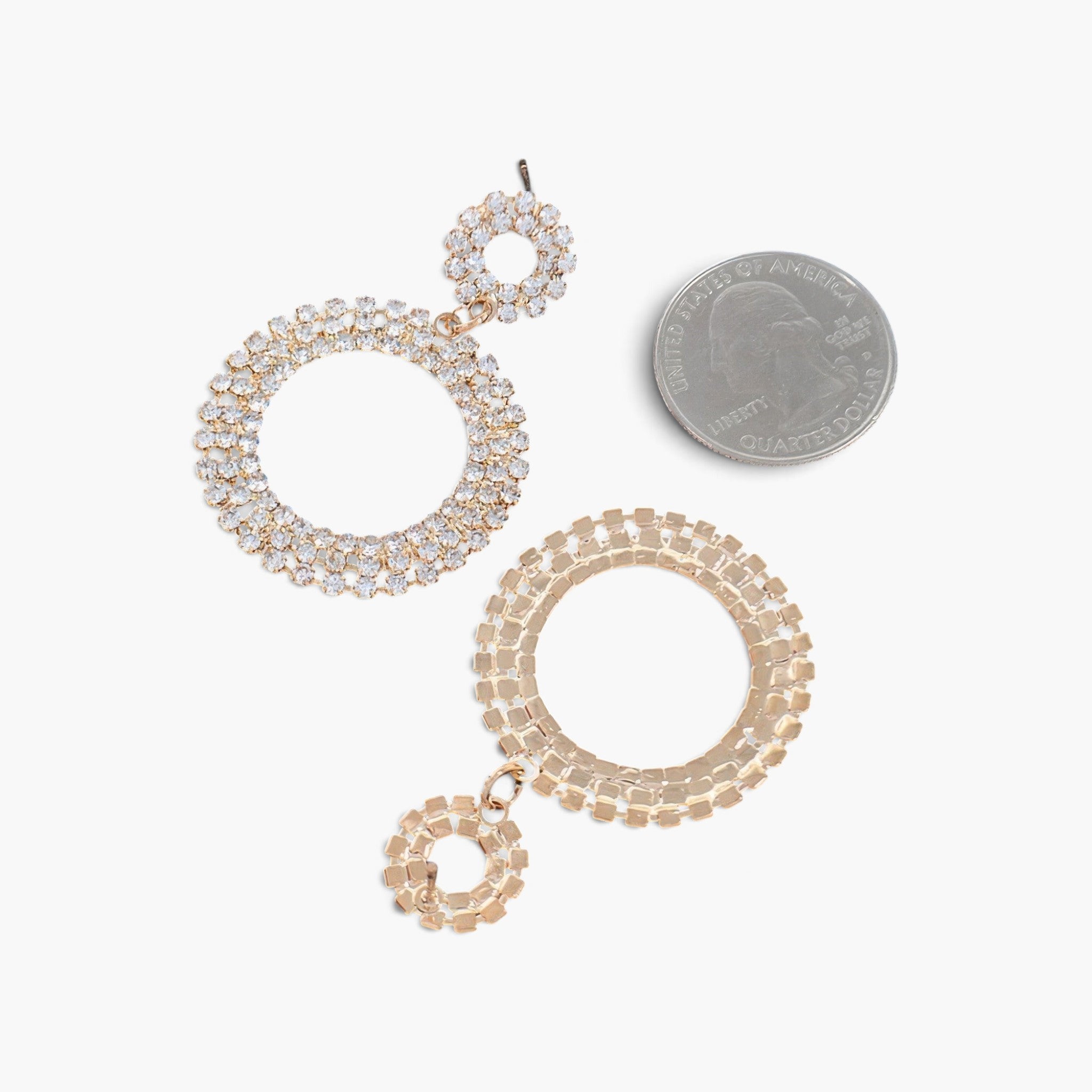 Beach Rose Co. gold-tone round circle dangle earrings featuring sparkling rhinestones next to a US quarter for scale.