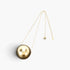 Beach Rose Co. gold round CCB ball pendant necklace with a delicate chain on a plain white background