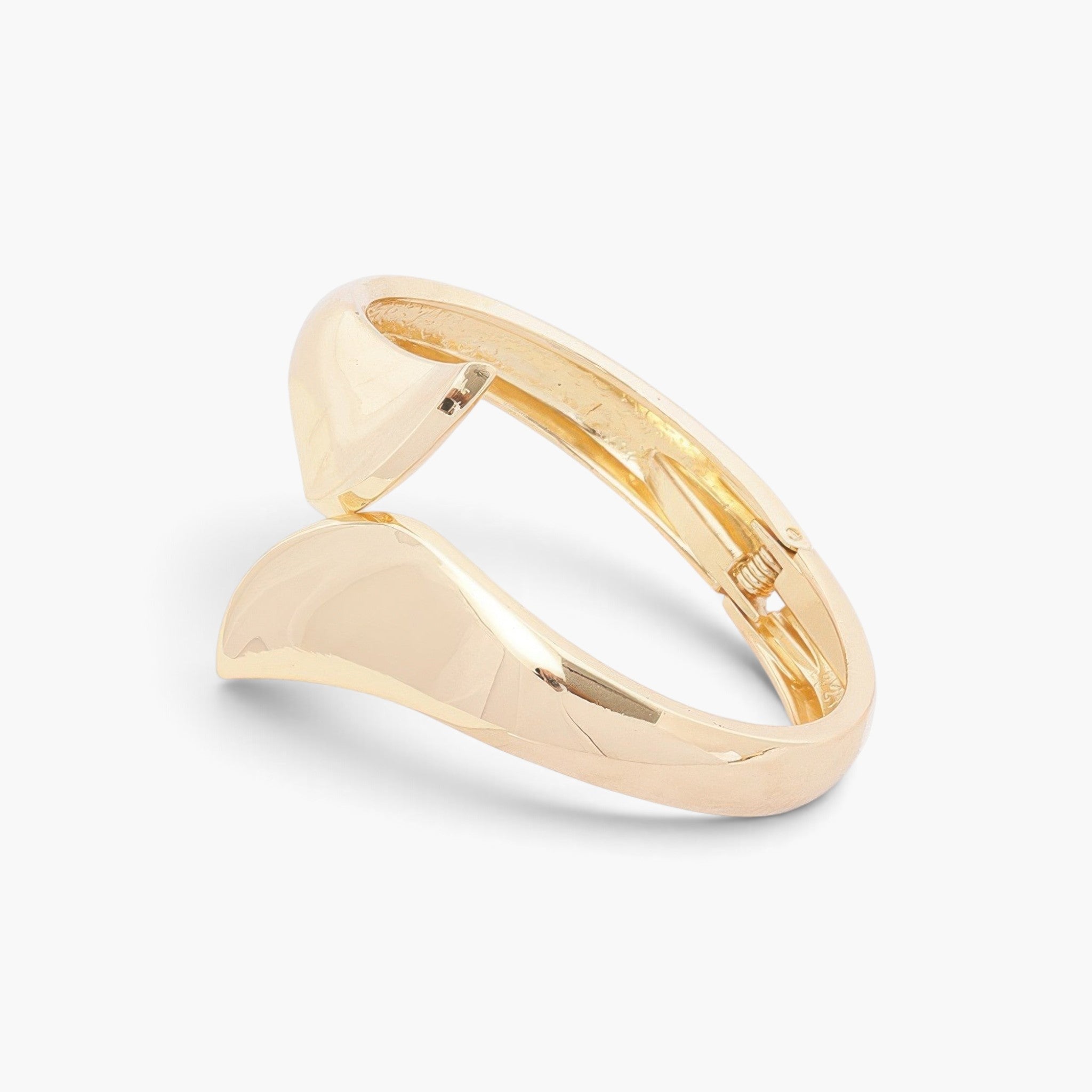 Beach Rose Co. gold-plated sculptural wrap bangle bracelet with a polished finish and bold overlapping ends.
