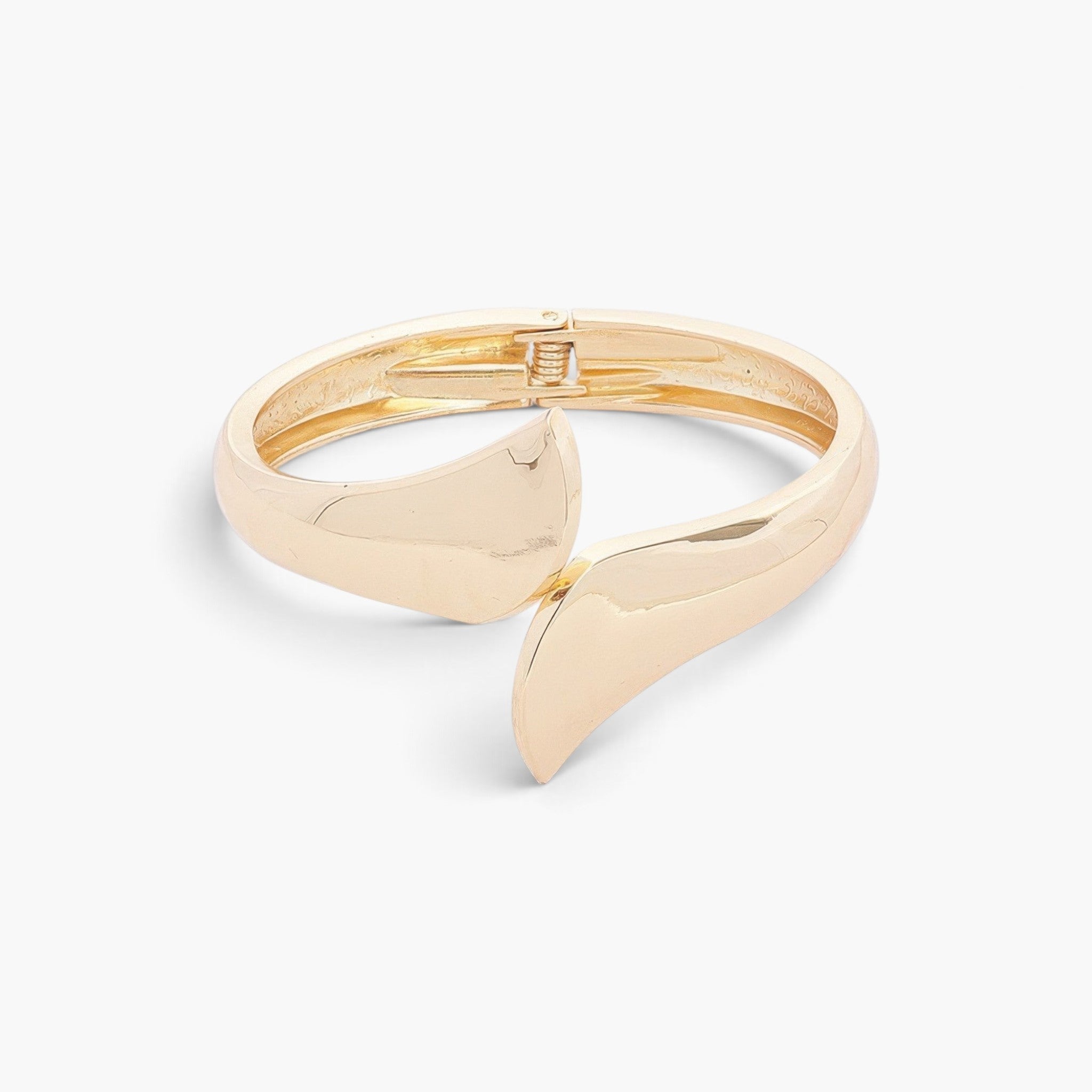 Beach Rose Co. gold-plated sculptural wrap bangle with a polished finish and bold overlapping ends.