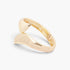 Beach Rose Co. gold-plated sculptural wrap bangle bracelet with a polished finish and bold overlapping ends.