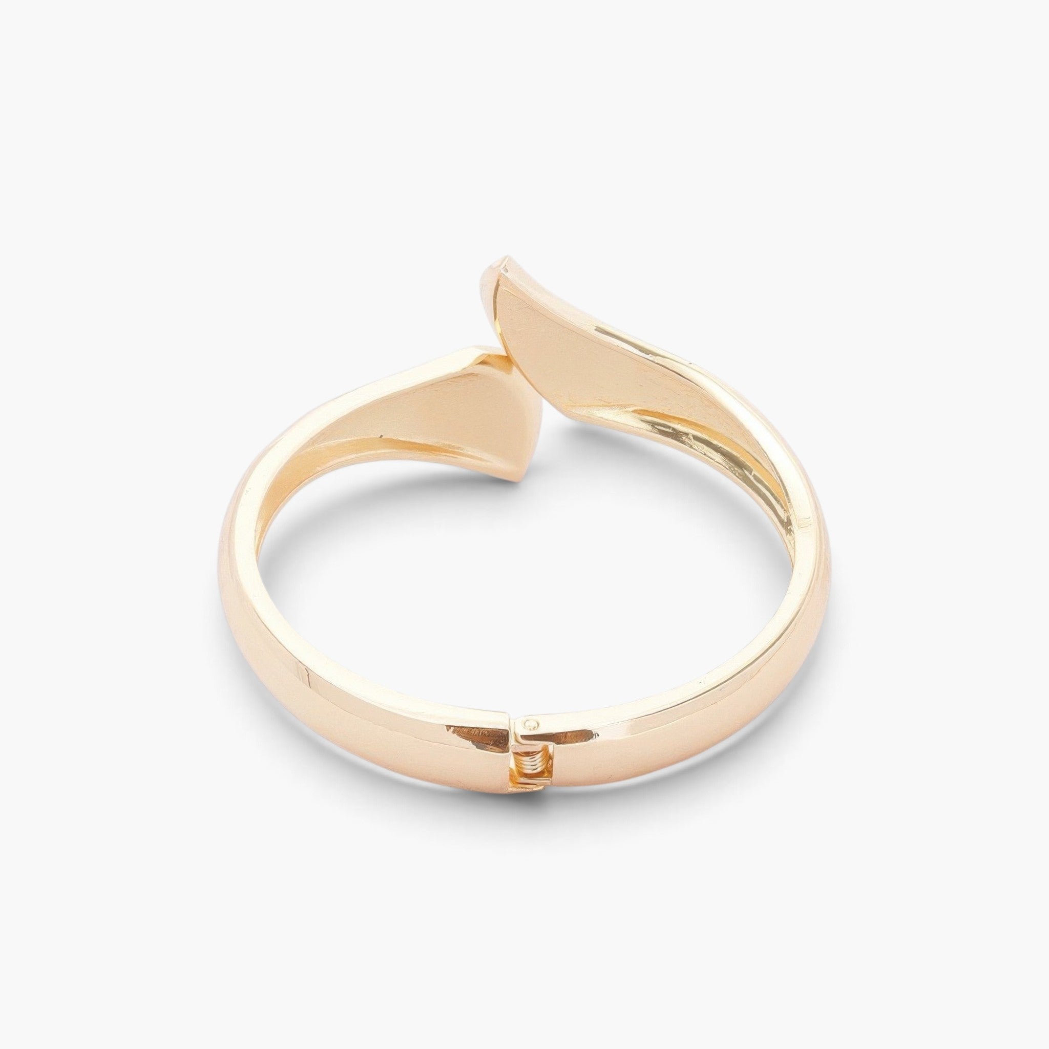 Beach Rose Co. gold-plated sculptural wrap bangle bracelet with a polished finish and bold overlapping ends.