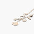Beach Rose Co. gold chain necklace featuring delicate sea-themed charms including seashells, a seahorse, and fish.