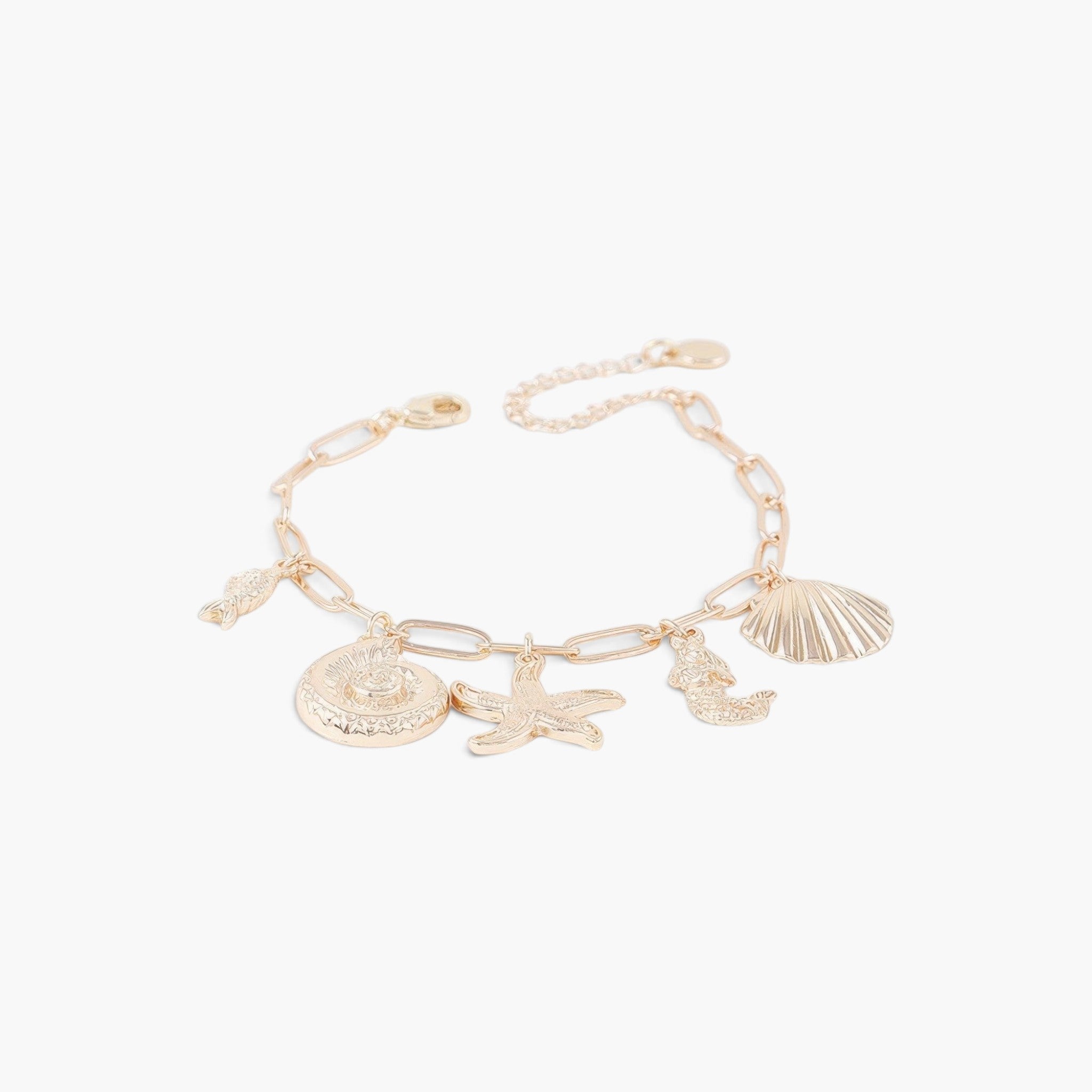 Beach Rose Co. gold chain bracelet featuring various sea creature charms like a starfish, seashell, and seahorse.