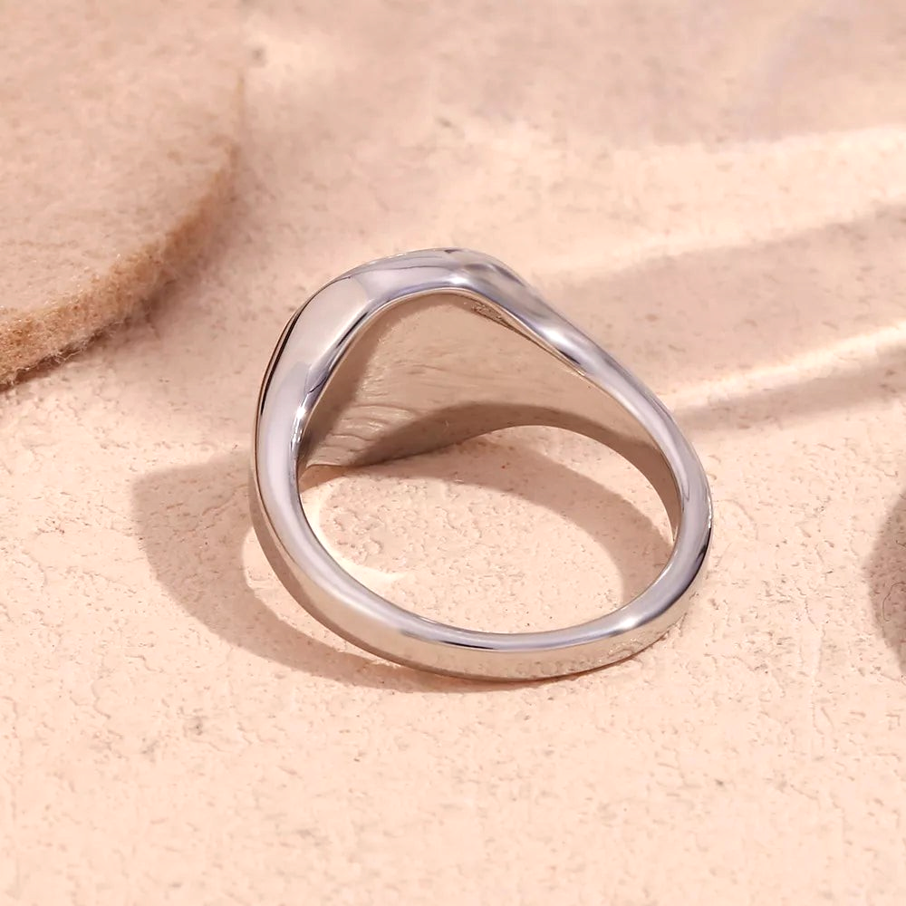 Beach Rose Co. gold-plated signet ring with a tapered band and polished finish, viewed from the side.