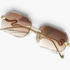 Beach Rose Co. rimless geometric sunglasses with brown gradient lenses and gold snake temple details.