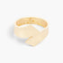 Beach Rose Co. gold-plated metal bangle featuring a sleek minimalist design and a functional spring hinge closure.