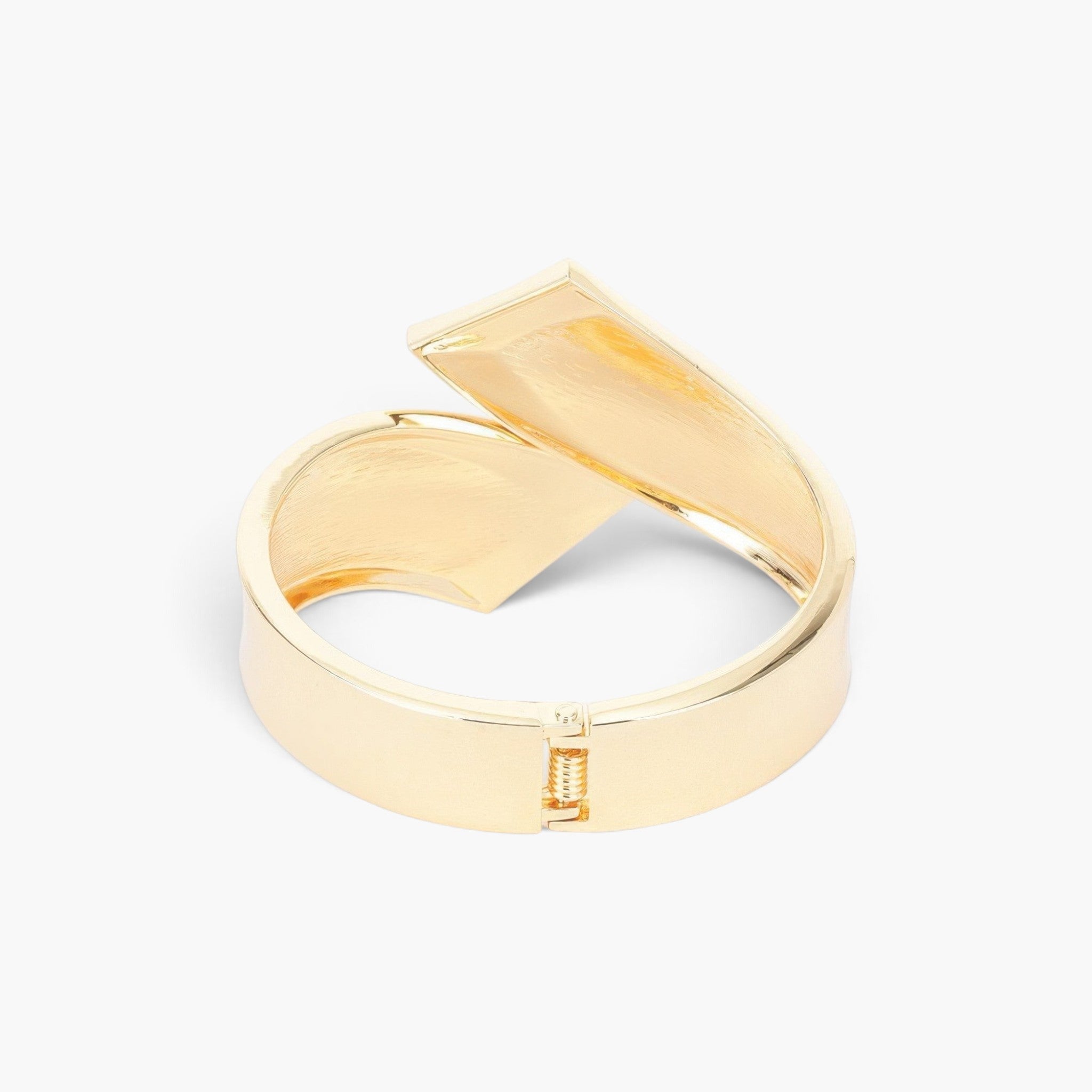 Beach Rose Co. gold-plated metal bangle bracelet with a functional spring hinge design on a white background.