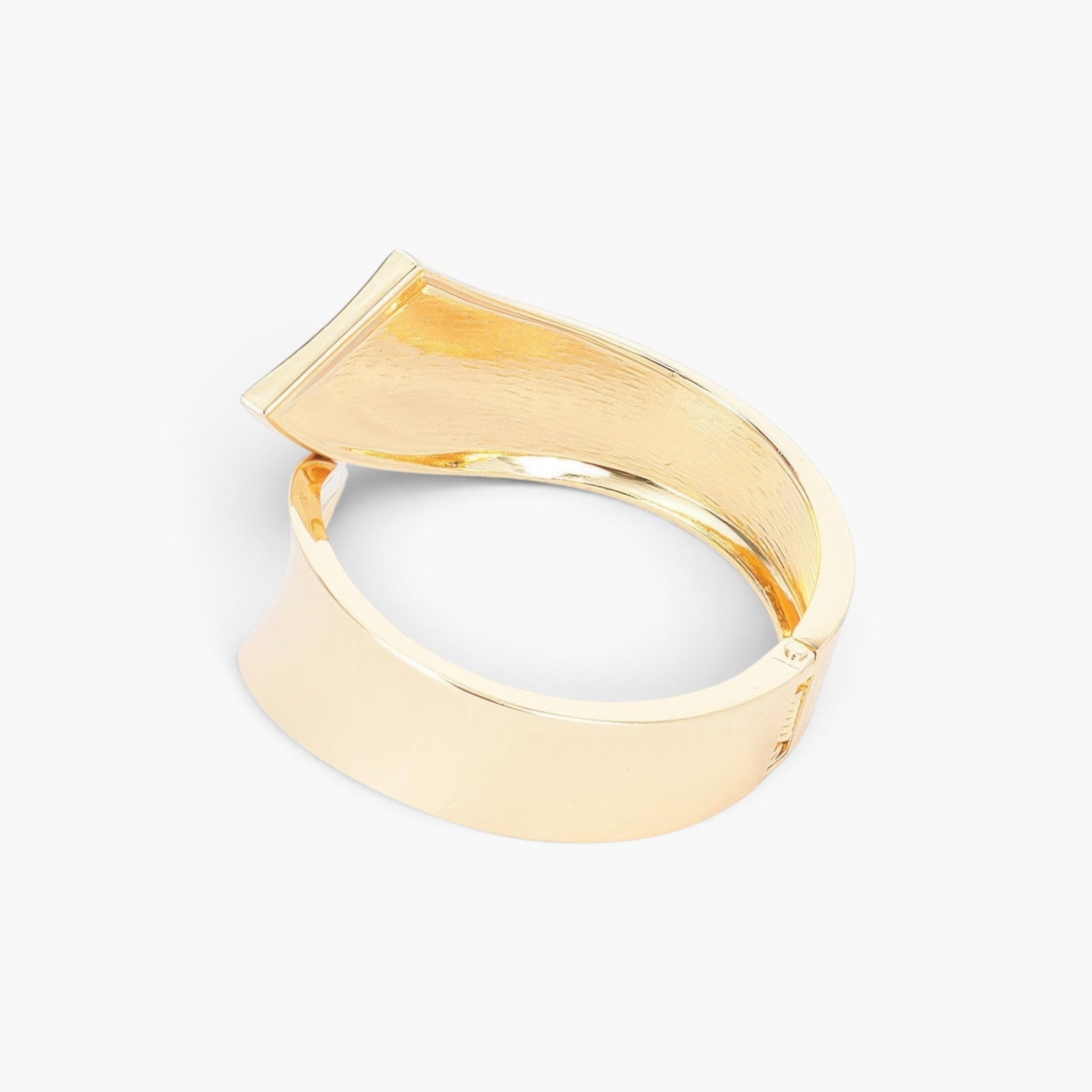 Beach Rose Co. gold-plated metal bangle bracelet featuring a sleek minimalist design and a functional spring hinge.