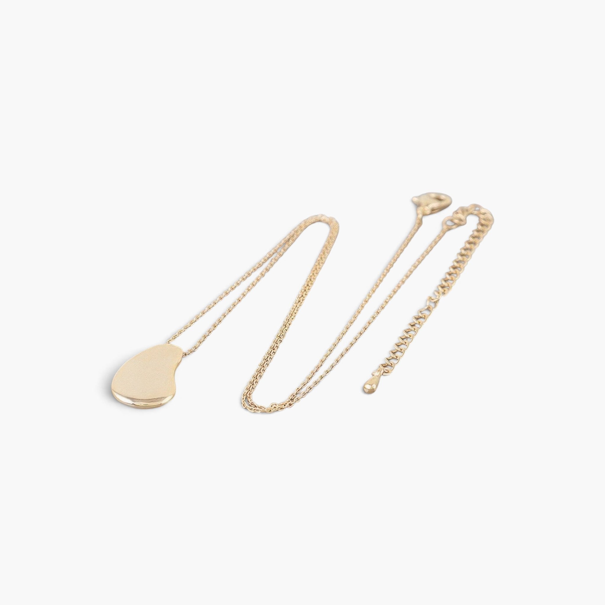 Beach Rose Co. gold teardrop chain necklace with a minimalist disc charm on a delicate chain.