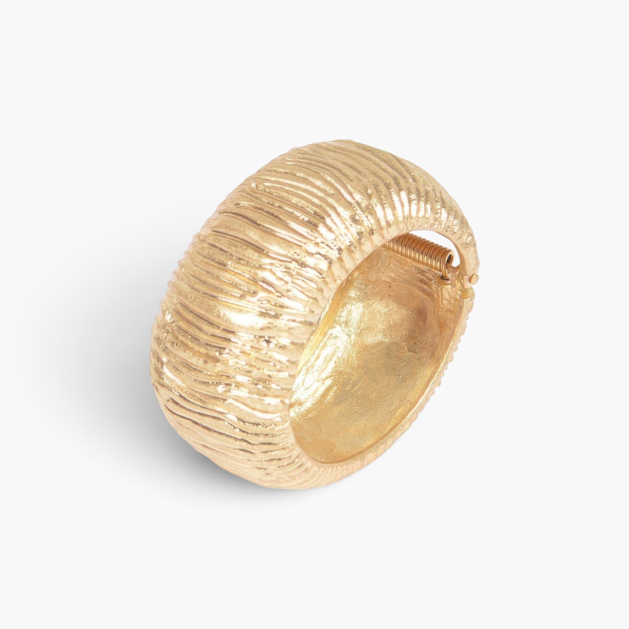 Beach Rose Co. gold cast metal cuff bracelet with a textured surface and a convenient spring hinge closure.