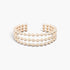 Beach Rose Co. wide gold cuff bracelet featuring three rows of polished spherical beads in an adjustable open design.