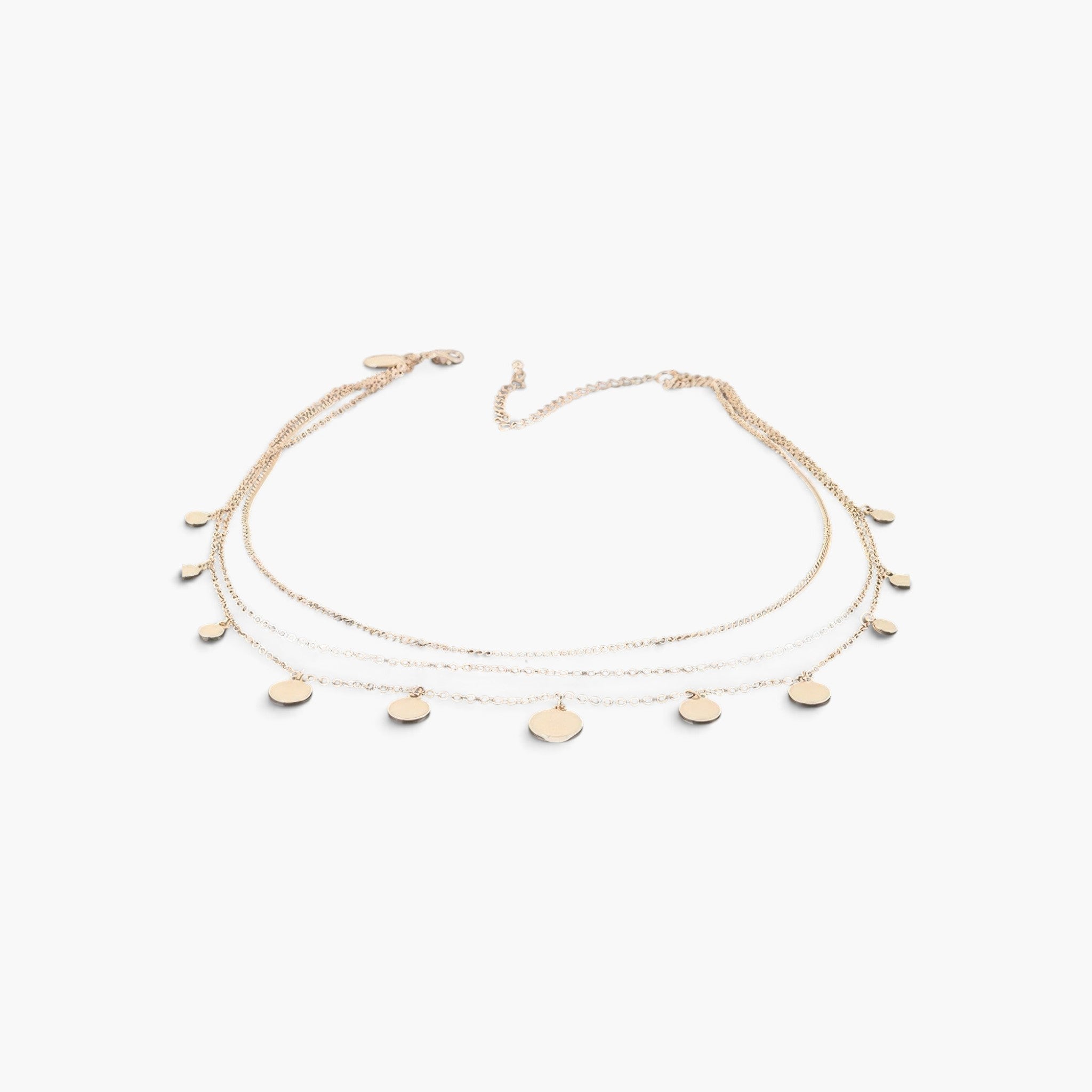 Beach Rose Co. gold triple chain necklace featuring delicate round charms on a polished metal fine chain.