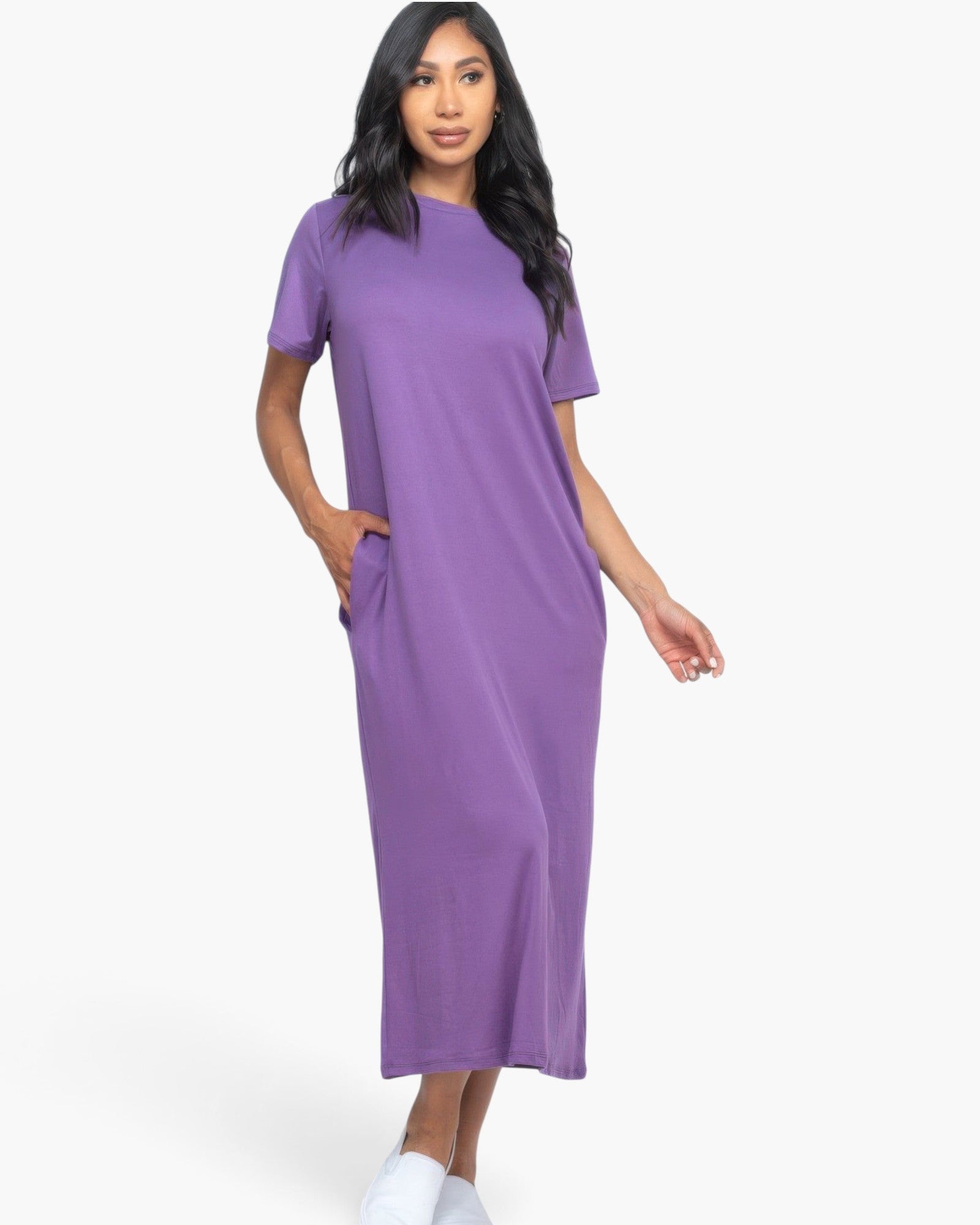 Beach Rose Co. grape purple midi tee dress with short sleeves and side pockets worn by a model on a white background