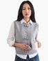 Beach Rose Co. gray sweater vest with decorative bows and button accents layered over a white shirt