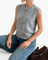 Beach Rose Co. heather gray sweater vest featuring decorative bows and covered buttons, worn with blue jeans.
