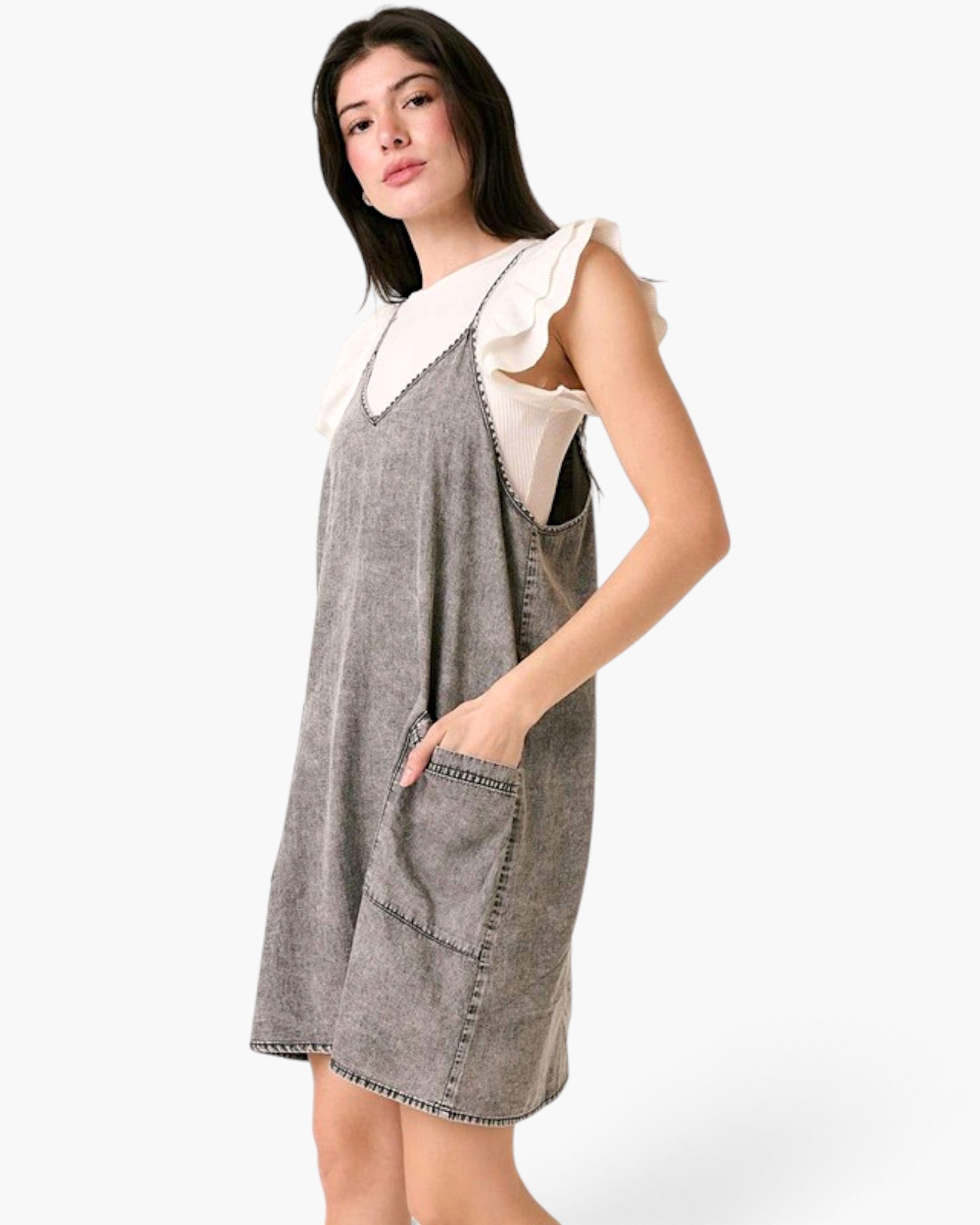 Beach Rose Co. gray washed denim overall dress with oversized pockets and a relaxed shift silhouette on a model.