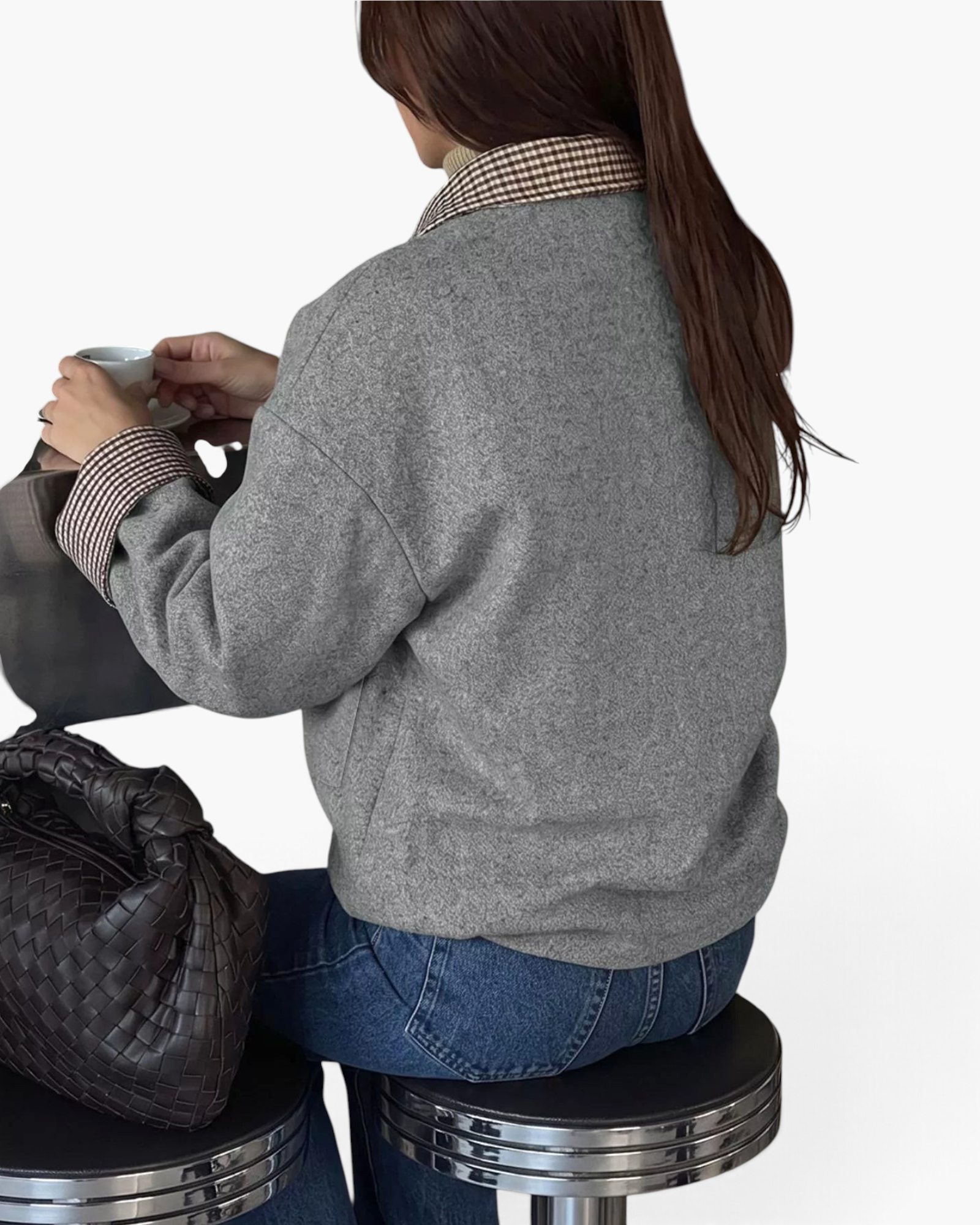 Beach Rose Co. gray polyester jacket with brown and cream gingham collar and cuffs worn by a woman sitting