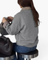 Beach Rose Co. gray polyester jacket with brown and cream gingham collar and cuffs worn by a woman sitting