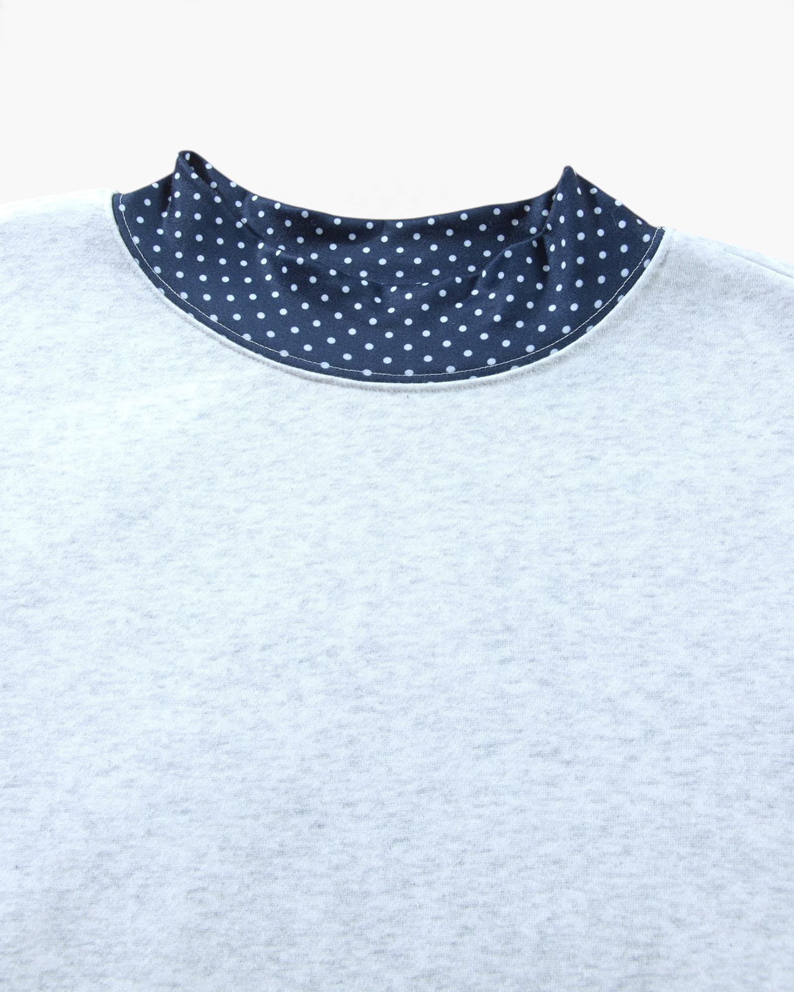 Beach Rose Co. light gray heathered sweatshirt featuring a navy blue mock neckline with white polka dot pattern.