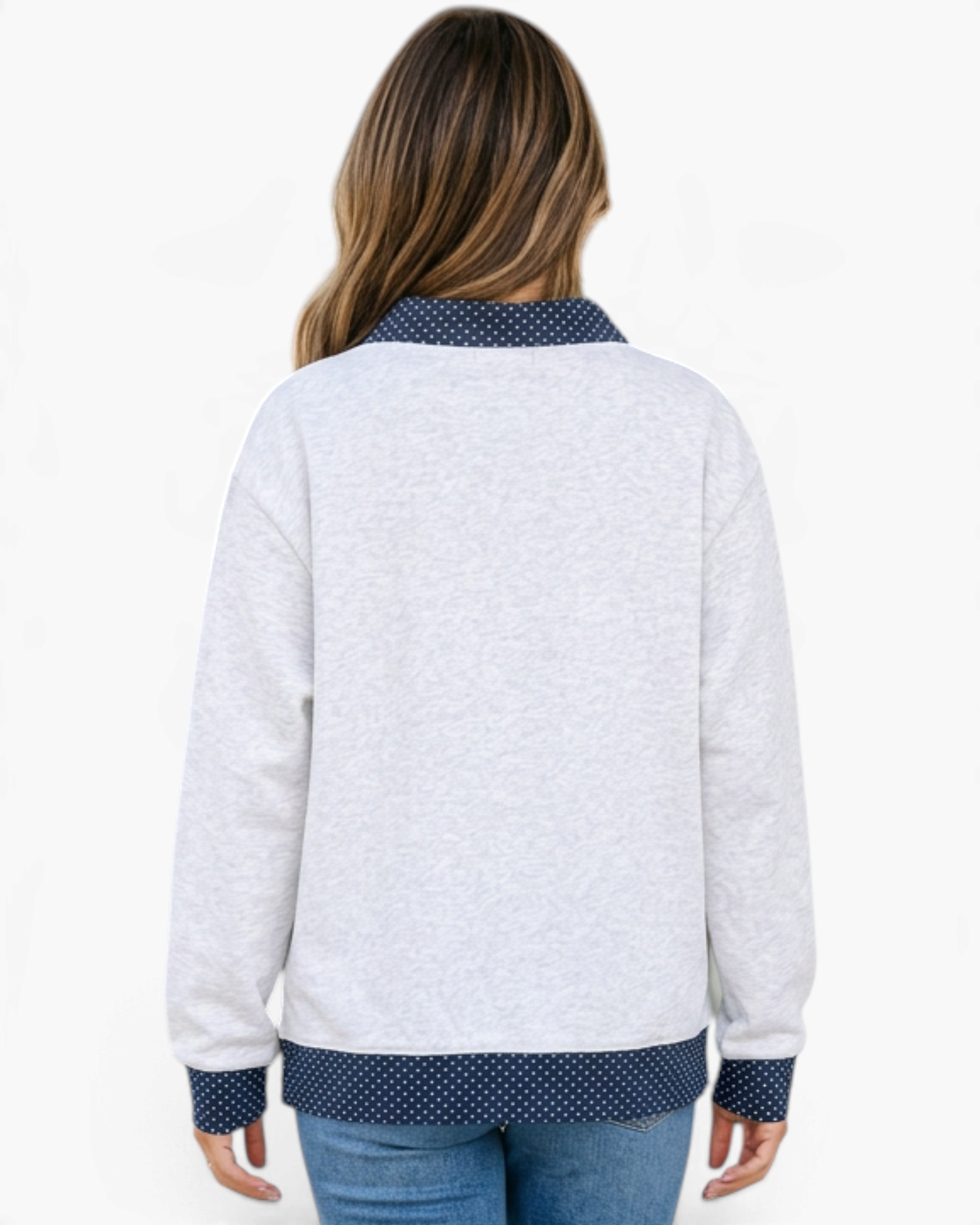 Beach Rose Co. light gray mock neck sweatshirt with navy polka dot trim on cuffs and hem, back view on a model.