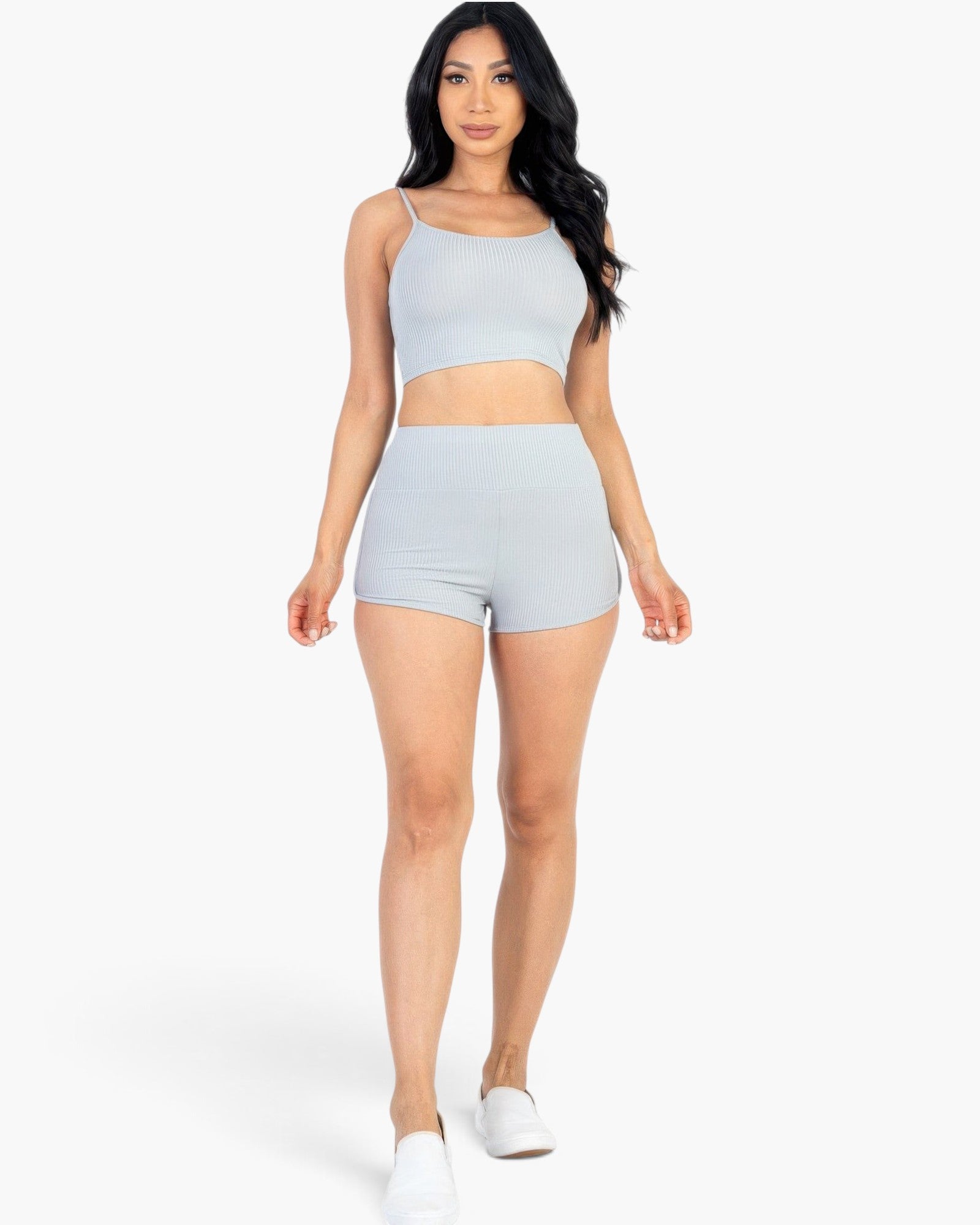 Beach Rose Co. model wearing a light gray ribbed cami crop top and matching high-waisted shorts set