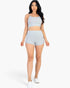Beach Rose Co. model wearing a light gray ribbed cami crop top and matching high-waisted shorts set